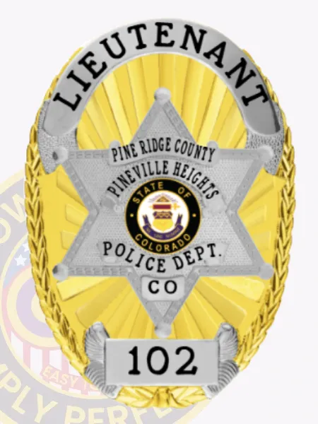 A stunning custom flex badge in gold with silver accents is presented in this image, secured with a safety pin. The title "LIEUTENANT" is prominently featured at the top, while the lower section displays "PINE RIDGE COUNTY PINEVILLE HEIGHTS POLICE DEPT. CO," surrounding a state emblem. The badge includes the number "102" at its base, adding a personal touch.
