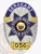 A striking custom metal badge in silver, featuring gold and blue reverse enamel panels, prominently displaying "SERGEANT" at the top. The center showcases a bold star design with "POLICE DEPT. CEDAR FALLS" and an emblem for "STATE OF ARIZONA." Below, the badge includes the number "056." Designed with a safety pin attachment, this badge ensures secure and convenient wear on uniforms.