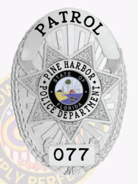 This custom metal badge in silver features an intricate star design, prominently displaying "PATROL" at the top. The center showcases a circular emblem with "PINE HARBOR POLICE DEPARTMENT" and the state seal of Florida, while the number "077" is highlighted below, all securely attached with a velcro backing for easy wear.