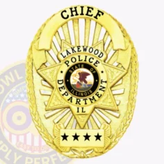 Vintage Oval Shield With 7 Point Star Center, Sunburst Background, 6 Text Panels, Reef Edge 8 A polished custom metal badge in gold incorporates an intricate star pattern, reading "chief" elegantly at the top. The badge includes a central round emblem featuring "lakewood police department" and the illinois state insignia, along with "il" and three stars below, designed for convenience with a safety pin attachment.