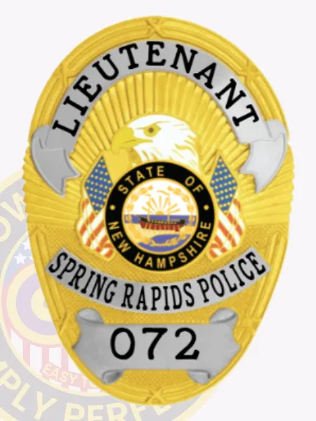 This custom metal badge in gold showcases stylish silver panels, highlighting "LIEUTENANT" boldly at the top. The centerpiece features an eagle, framed by a circular emblem that reads "STATE OF NEW HAMPSHIRE," along with the text "SPRING RAPIDS POLICE" and the number "072." The badge comes with a velcro attachment for convenient fastening.
