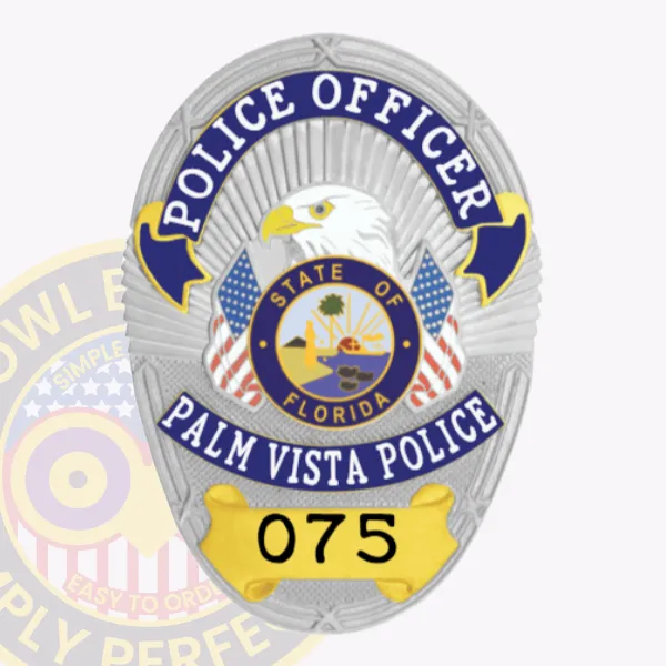 This elegant custom metal badge in silver is adorned with striking gold and blue reverse enamel panels. It prominently features "POLICE OFFICER" at the top, with an eagle and state emblem in the center, along with "PALM VISTA POLICE" and "075," all firmly fastened with a safety pin for convenience.