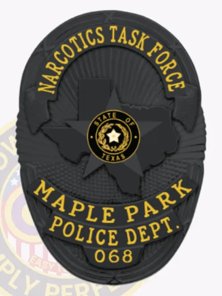 A striking custom metal badge in black features the title "NARCOTICS TASK FORCE" at the top in bold letters. The badge's center showcases a star emblem that represents Texas, surrounded by "MAPLE PARK POLICE DEPT." and "068." It includes a safety pin attachment for reliable fastening.