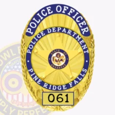 This elegant gold custom metal badge showcases blue reverse enamel panels and reads "police officer" in bold letters at the top. The center features "police department" and "pine ridge falls," along with a detailed star emblem that includes "state of arkansas. " at the bottom, it shows "061" and is designed with a safety attachment for easy fastening on official attire.