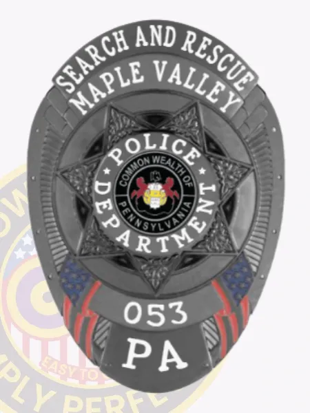 A striking custom metal badge in black that prominently displays "SEARCH AND RESCUE" across the top and "Maple Valley" below it. The center showcases a star design featuring "POLICE DEPARTMENT," along with the numbers "053" and "PA" at the bottom. This badge comes with a safety pin attachment, allowing for easy fastening to uniforms or clothing for law enforcement professionals.