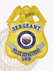Shield badge made of gold metal featuring a raised gold eagle atop with "GREENFIELD" on its banner, silver panels showing "SERGEANT" and "POLICE DEPARTMENT 189" in black lettering, and the Arizona state emblem in blue and white centered, attached by safety pin.