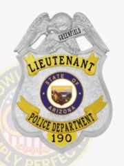 Silver and gold custom police badge for Greenfield lieutenant, showing a detailed silver eagle atop the shield, "GREENFIELD" on a small banner beneath the eagle, the rank "LIEUTENANT" in striking black letters on a gold upper panel, a circular blue and gold Arizona state emblem in the middle, and "POLICE DEPARTMENT 190" on a gold lower panel with a safety pin fastener.