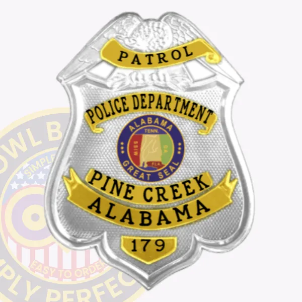 Pine Creek police custom patrol badge made in silver metal with a detailed eagle figure at the top, textured silver background, gold banners bearing black lettering for "PATROL," "POLICE DEPARTMENT," and "PINE CREEK ALABAMA," centered around the Alabama Great Seal, designed to attach securely with a safety pin.