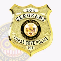 Shiny custom gold shield metal badge for coral cove police the sergeant with safety pin attachment, presenting a textured gold shield with black text reading "sergeant," "coral cove police," "hi," the official hawaii state seal centrally located, and "204" displayed on a top panel.