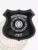 Sleek custom black shield metal badge for Pine Hurst police the hostage negotiations with safety pin attachment, showing a dark black metal badge shaped like a shield, textured background, bold white letters stating "HOSTAGE NEGOTIATIONS" across the top, "PINE HURST POLICE DEPARTMENT" circling the Connecticut state emblem, and "197" prominently displayed below.