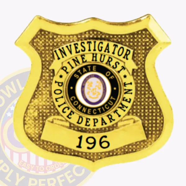 Custom gold shield metal badge for Pine Hurst police the investigator with safety pin attachment, showing a bright gold shield with dotted texture, bold black text reading "INVESTIGATOR," circular text "PINE HURST POLICE DEPARTMENT" around the Connecticut seal, and number "196" prominently on a bottom ribbon.