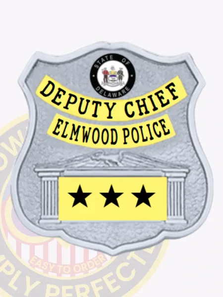 Detailed custom silver shield metal badge with gold panels for Elmwood police the deputy chief with safety pin attachment, featuring a bright silver shield background, black uppercase letters on gold banners saying "DEPUTY CHIEF" and "ELMWOOD POLICE," official Delaware state seal in color at the top, and three black stars on a gold panel decorated with column designs.