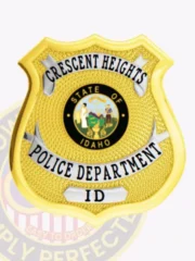 Crescent Heights Police Department’s custom gold shield metal badge accented with silver panels, black lettering on silver banners reading "Police Department ID," a detailed Idaho state insignia in the center, finished with a safety pin attachment.