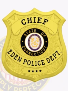 Custom gold shield metal badge for eden police the chief with safety pin attachment, displaying a reflective gold shield with dotted texture, black text panels labeled "chief," "eden police dept. ," four stars on a bottom banner, and the official connecticut state emblem centered.