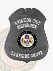 Custom black shield badge for Lakeside Grove police aviation unit, displaying a raised eagle at the top, prominent white letters "AVIATION UNIT POLICE DEPARTMENT" and "LAKESIDE GROVE" around the multi-colored Arkansas state seal, attached with a safety pin on the back.