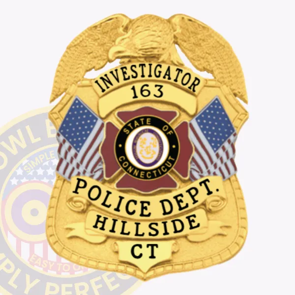 Investigator badge for Hillside Police made of gold metal with a raised eagle atop the shield, yellow banners showing "INVESTIGATOR 163" and "POLICE DEPT. HILLSIDE CT," and a central red Connecticut emblem between two American flags, fastened with a safety pin.