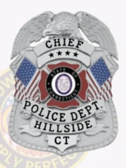 Silver eagle top shield metal badge for Hillside Police Chief featuring a silver eagle figure at the top with wings spread wide, the word "CHIEF" and four stars on a white banner, the State of Connecticut seal between two American flags in the center, and "POLICE DEPT. HILLSIDE CT" on the bottom banner, designed with safety pin attachment.