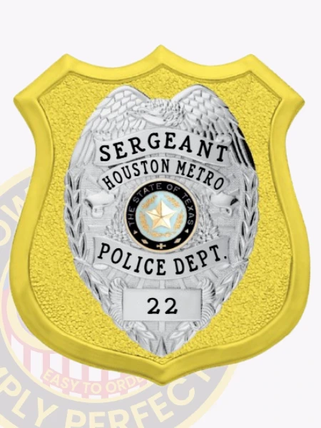 Detailed custom gold shield metal badge with an inner eagle top shield for Houston Metro police the sergeant with safety pin attachment, featuring a reflective gold shield with a silver eagle badge on top, black text panels labeled "SERGEANT," "HOUSTON METRO," "POLICE DEPT.," and "22," and the Texas state seal in full color at the center.