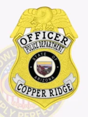 Copper Ridge police officer badge made of gold metal with a large gold eagle on top, silver panels with black text for "OFFICER," "POLICE DEPARTMENT," and "COPPER RIDGE," featuring the Arizona state seal in the center black circle, attached via safety pin.