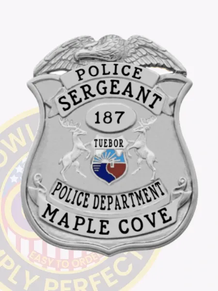 Maple Cove police sergeant custom silver metal badge shaped like a shield with an eagle figure on top, black text banners reading "POLICE SERGEANT," "POLICE DEPARTMENT," and "MAPLE COVE," centered by a silver oval marked "187" and a colorful emblem, attached with safety pin.