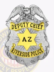 Sleek silver police badge featuring an eagle at the top, gold banners with black letters saying "DEPUTY CHIEF" and "RIVERSIDE POLICE," a central gold star marked "AZ," made for Riverside police deputy chief with a safety pin attachment.