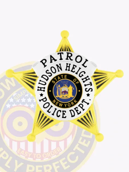Custom metal badge with a gold five-point star and silver panels for Hudson Heights Police patrol, including black lettering “PATROL HUDSON HEIGHTS POLICE DEPT.” framing the New York state seal at the center, and secured by a safety pin.