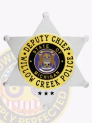 This image highlights a custom 6 point star flex badge for Willow Creek police, representing the rank of Deputy Chief. The badge showcases a silver finish with eye-catching gold panels, adorned with a circular emblem that reads "WILLOW CREEK POLICE" and "STATE OF MICHIGAN," complete with a practical velcro attachment.