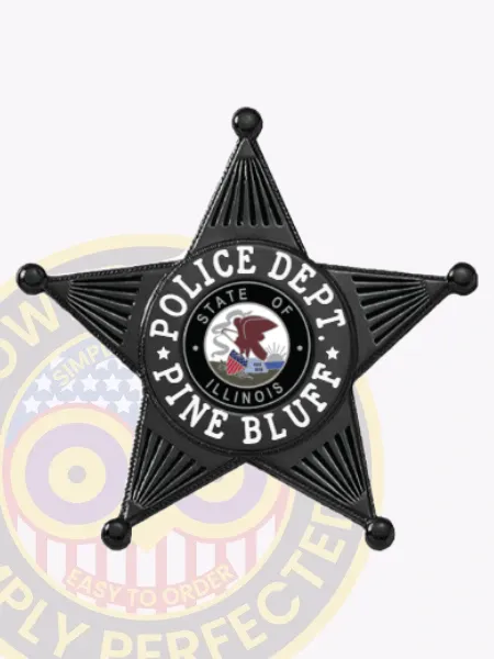 Black five-point star metal badge for Pine Bluff Police Department, showing bold white lettering around the star reading “POLICE DEPT. PINE BLUFF” with the official Illinois state emblem centered, attached by a safety pin.
