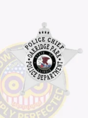 Oakridge Park Police Chief custom silver metal badge shaped as a five-point star, featuring black text around the center reading “POLICE CHIEF OAKRIDGE PARK POLICE DEPARTMENT,” the Illinois state seal in the middle, three stars above, and a safety pin attachment.