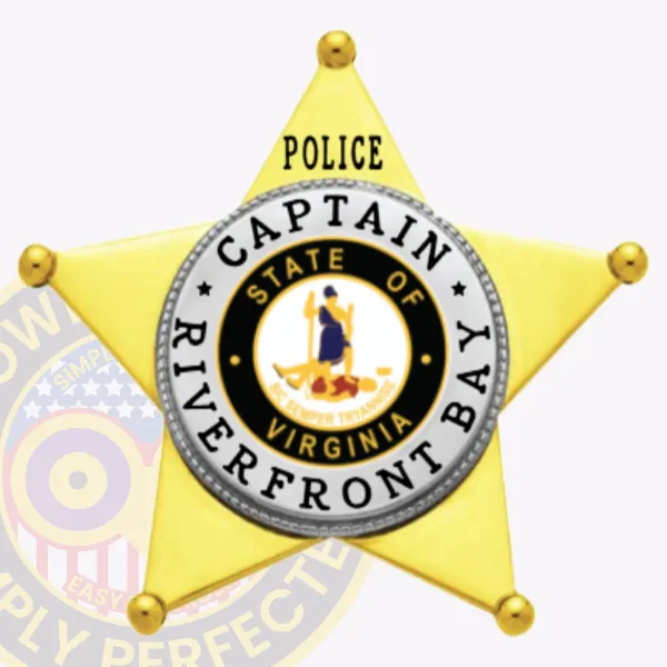 Custom metal badge shaped as a gold 5 point star with silver panels for Riverfront Bay Police Captain, featuring black text surrounding the Virginia state emblem reading “POLICE CAPTAIN RIVERFRONT BAY,” finished with a safety pin attachment.