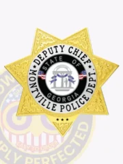 Polished gold custom metal badge featuring a silver circle panel, prominently displaying the title "DEPUTY CHIEF" at the top in bold black letters. The star-shaped badge includes "MONTVILLE POLICE DEPT." and "STATE OF GEORGIA" surrounding the central emblem, all secured with a safety pin attachment for convenient wear.