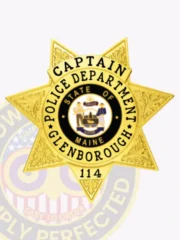 Bright gold custom metal badge showcasing "CAPTAIN" elegantly at the top in clear black font. The badge features an intricate star design with "POLICE DEPARTMENT" and "GLENBOROUGH," along with a central emblem representing "STATE OF MAINE," all secured with a reliable safety pin attachment for ease of use.