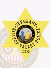 Displaying a polished gold appearance, this custom 6 pointed star metal badge for Hilltop Valley Police features the inscription "SERGEANT" above "HILLTOP VALLEY POLICE" surrounding the North Carolina state seal. The safety pin attachment allows for easy fastening, combining style and practicality.