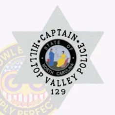 This custom 6 pointed star metal badge for hilltop valley police shines in silver, with "captain" beautifully arranged above "hilltop valley police" surrounding the central north carolina state seal. The safety pin attachment provides secure placement, making it a perfect accessory for police personnel.