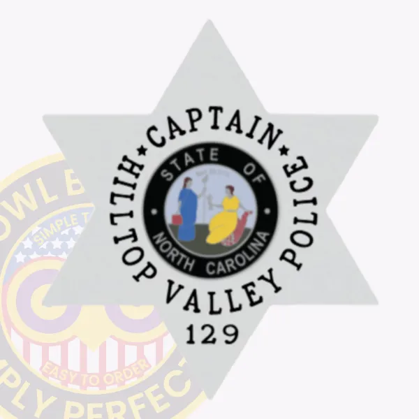 This custom 6 pointed star metal badge for Hilltop Valley Police shines in silver, with "CAPTAIN" beautifully arranged above "HILLTOP VALLEY POLICE" surrounding the central North Carolina state seal. The safety pin attachment provides secure placement, making it a perfect accessory for police personnel.