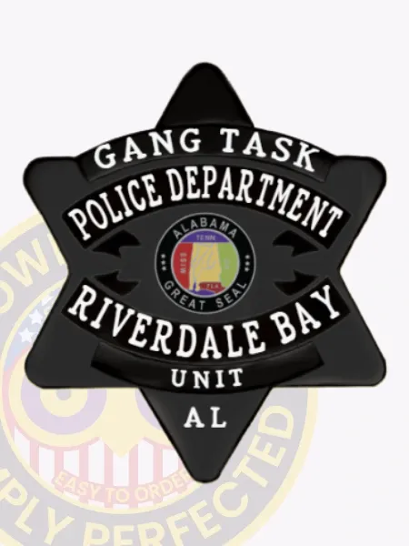 Custom black 6-point star metal badge for Riverdale Bay Police Gang Task Unit, featuring prominent white text on black curved stripes saying "Gang Task," "Police Department," and "Riverdale Bay," with a central Alabama state seal in multiple colors, and "Unit AL" at the base; secured with a safety pin attachment.