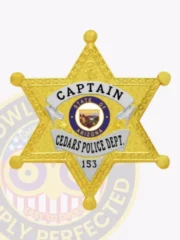 Gold six-pointed star badge for Cedars Police Captain, displaying detailed engravings on each point, black lettering on bright silver banners around a colorful Arizona state seal, and a safety pin fastener.