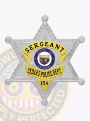 Cedars Police custom silver star-shaped metal badge with gold accent panels labeled "Sergeant," featuring the "State of Arizona" seal in the center, "Cedars Police Dept." below it, and "154" at the bottom, attached with a safety pin.
