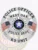 West Oak Police Department custom silver badge shaped as a six-point star for K9 Unit, featuring black embossed text including "POLICE OFFICER," "WEST OAK," and "K9 UNIT," accented with American flags and the Oklahoma state seal, attached with a safety pin.