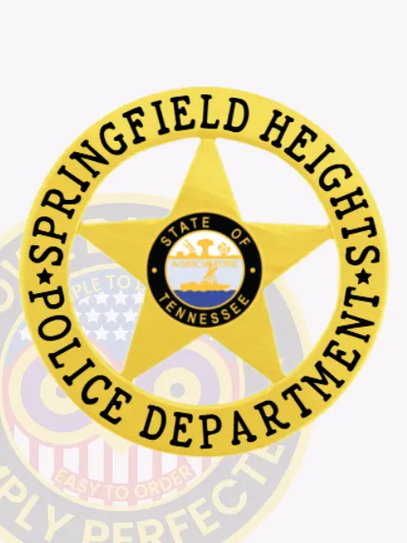 Showcased here is a custom gold badge featuring a prominent 5-point star surrounded by a circular banner displaying "SPRINGFIELD HEIGHTS" on top and "POLICE DEPARTMENT" on the bottom. The Tennessee state seal adds an official touch to the center, representing service and authority. This badge is specifically designed for Springfield Heights Police and features a velcro attachment for secure wearing.