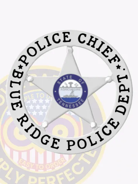 This image features a beautifully crafted silver metal badge with a distinctive 5 pointed star in the center, enclosed by a circular banner that reads "POLICE CHIEF" at the top and "BLUE RIDGE POLICE DEPT" below. The central portion showcases the Tennessee state seal, highlighting its law enforcement importance. This custom badge is designed for the Blue Ridge Police chief and includes a practical safety pin attachment.