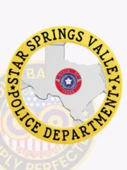 This image highlights a custom Texas metal badge designed for Star Springs Valley police, showcasing a polished silver silhouette of Texas at its core. Surrounded by a golden circular banner, the badge features the text "STAR SPRINGS VALLEY POLICE DEPARTMENT" around the edge. A safety pin on the back allows for reliable attachment.