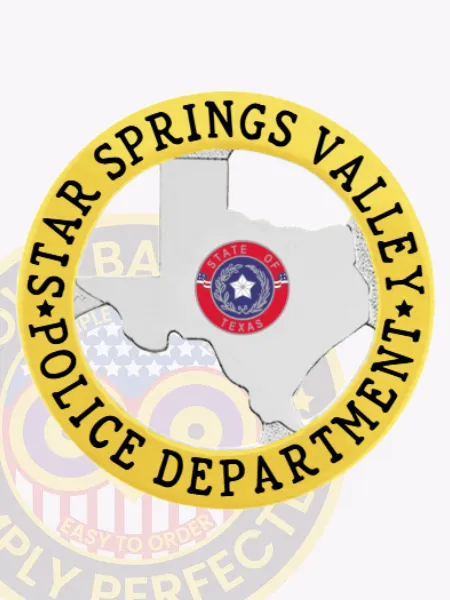 This image highlights a custom Texas metal badge designed for Star Springs Valley police, showcasing a polished silver silhouette of Texas at its core. Surrounded by a golden circular banner, the badge features the text "STAR SPRINGS VALLEY POLICE DEPARTMENT" around the edge. A safety pin on the back allows for reliable attachment.