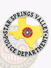 Featuring a custom Texas metal badge for the Star Springs Valley police, this design includes a shiny gold shape of Texas at its center, encircled by a silver banner. The badge prominently displays "STAR SPRINGS VALLEY POLICE DEPARTMENT" around the edge, with a safety pin attachment for easy and secure wear.