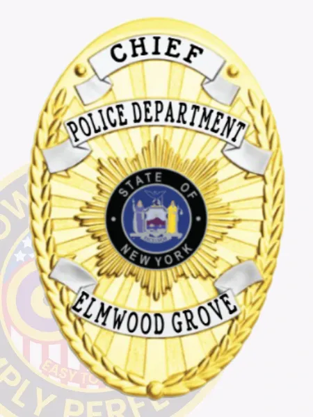 This custom metal badge in gold features elegant silver panels, prominently displaying the title "CHIEF" at the top in bold black letters. The center showcases a circular emblem with "STATE OF NEW YORK," surrounded by decorative elements. Below, "POLICE DEPARTMENT" and "ELMWOOD GROVE" are clearly inscribed. A safety pin attachment ensures secure wear on uniforms.