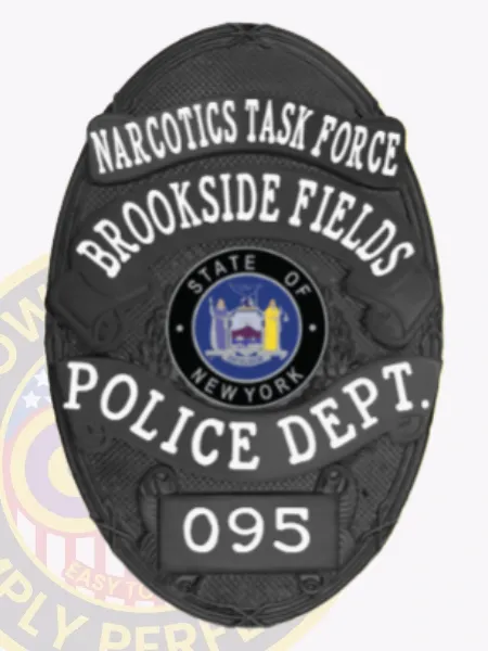 This custom metal badge in black prominently features "NARCOTICS TASK FORCE" at the top in bold white letters, creating a sharp contrast against the dark background. The center displays a circular emblem with "STATE OF NEW YORK," surrounded by decorative elements. Below, "BROOKSIDE FIELDS," "POLICE DEPT.," and the number "095" are clearly inscribed. A safety pin attachment ensures secure wear on uniforms.
