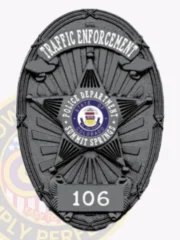 Distinctive black custom metal badge with "TRAFFIC ENFORCEMENT" written elegantly at the top in white letters. The star design includes "POLICE DEPARTMENT" around a central emblem of the Colorado state seal and "SUMMIT SPRINGS," plus the number "106," secured with a reliable safety pin attachment for practical use.