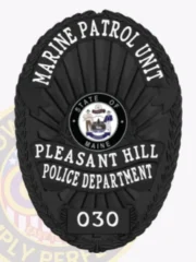 This stylish custom metal badge in black showcases a refined oval shape adorned with intricate details. The title "MARINE PATROL UNIT" is featured prominently at the top in bold white letters, with "PLEASANT HILL" directly below. The center displays the state seal of Maine, surrounded by "POLICE DEPARTMENT." A safety pin attachment provides an easy way to secure the badge.