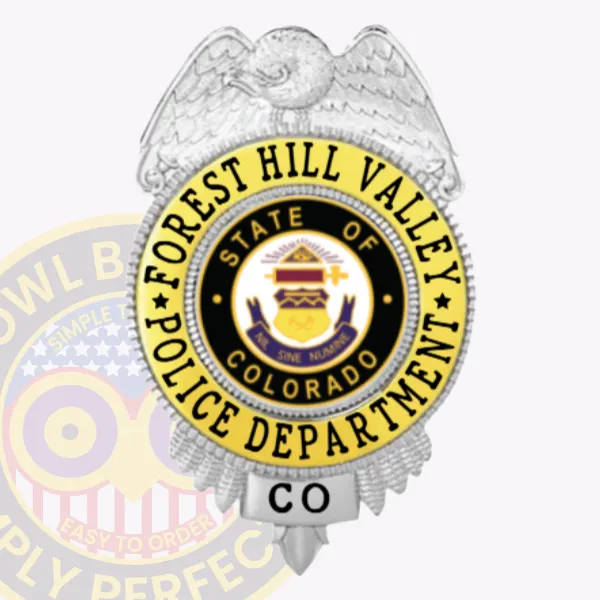 Custom silver eagle top shield metal badge for Forest Hill Valley police, accented with gold panels displaying black text "FOREST HILL VALLEY POLICE DEPARTMENT," featuring a detailed silver eagle above the colorful Colorado state emblem in the center, and "CO" on a silver panel below, mounted with a safety pin attachment.