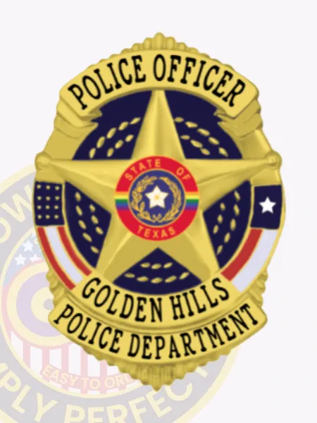 Gold shield-shaped metal badge for Golden Hills Police Officer, displaying a central 5-point star surrounding the State of Texas seal, with “Police Officer” at the top and “Golden Hills Police Department” on the bottom, attached by a safety pin.